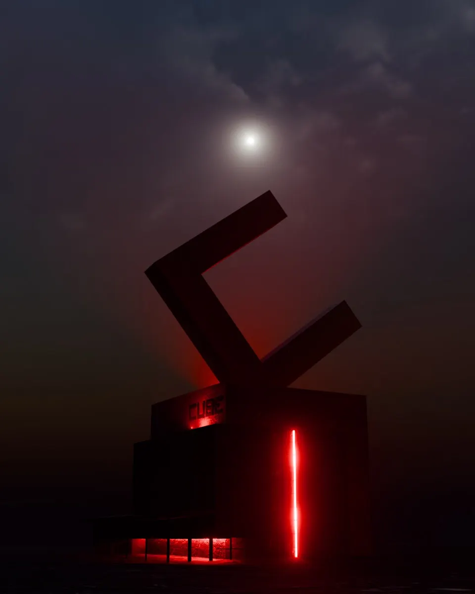 Il Cube Club di notte con il logo illuminato di rosso